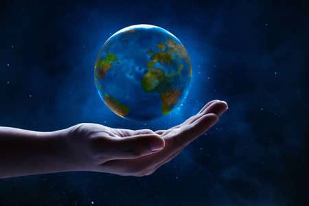 Human hand holding planet earthの写真素材