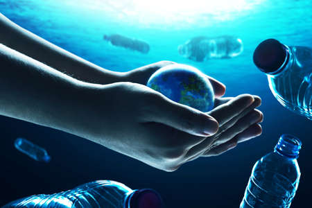 Human hand holding planet earth