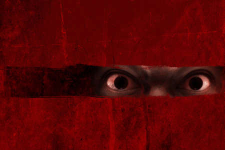 Man possessed on dark backgroundの写真素材