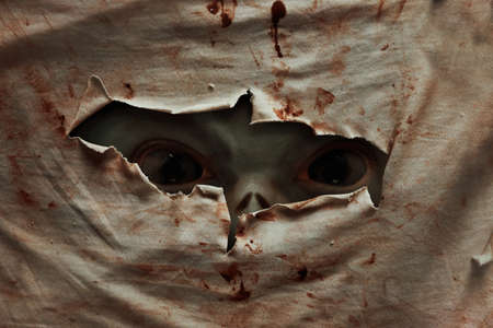 Man possessed on dark backgroundの写真素材