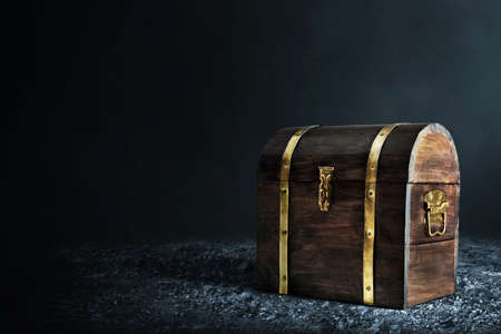 Wooden treasure chest on dark backgroundの写真素材
