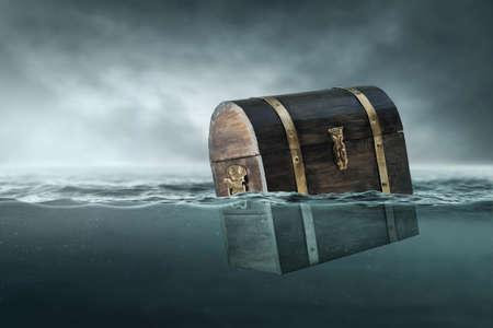 Wooden treasure chest on dark background