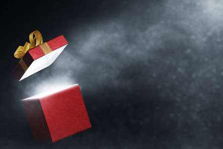 Red gift box on dark background