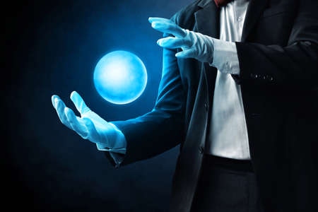 Magician hands showing magic trickの写真素材