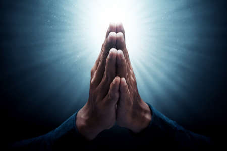 Muslim man greeting on dark background