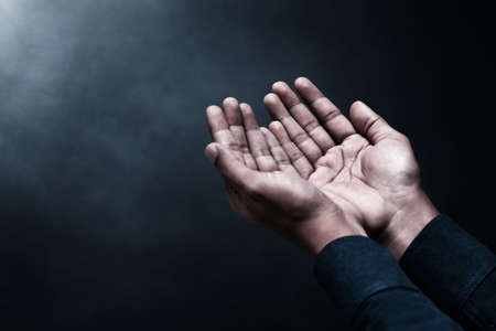Muslim man holding holy quran