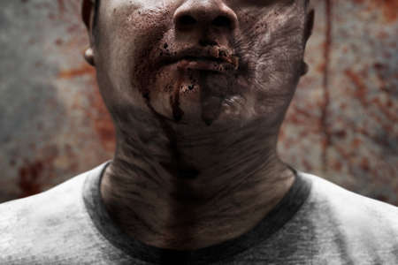 Scary zombie man on dark background