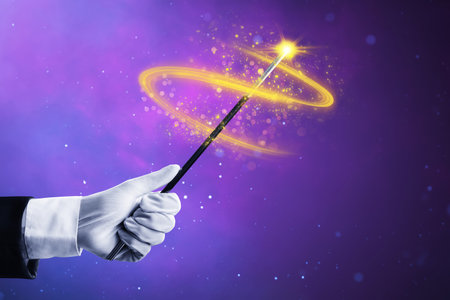 Magician hand holding magic wandの写真素材