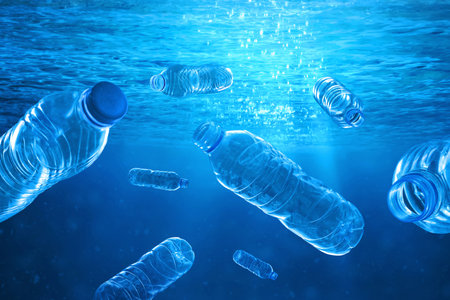Full plastic bottles underwater with sunlight, Pollution concept