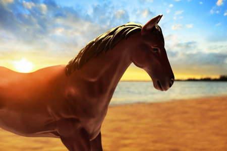 Portrait of a horse on tropical sea beach at beautiful sunset sky with cloudの写真素材