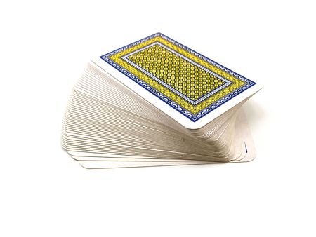 Pack of playing cards with a dark blue and yellow shirt isolated on a white backgroundのeditorial素材
