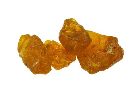 Some pieces of orange rosin isolated on a white backgroundの写真素材