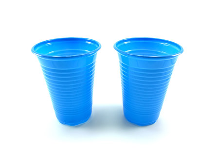 Two dark blue plastic glasses isolated on a white backgroundの写真素材