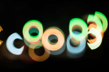 Color circle bokeh on black background.