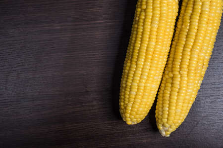 Corn on wood background.の写真素材