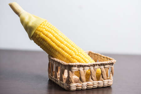 Corn in basket on white background.の写真素材