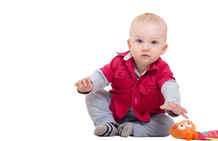 Funny little boy playing with toy