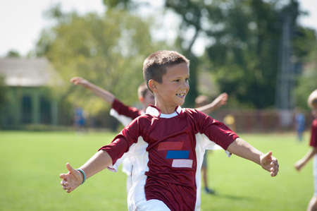 happy boy rejoices after victoryのeditorial素材