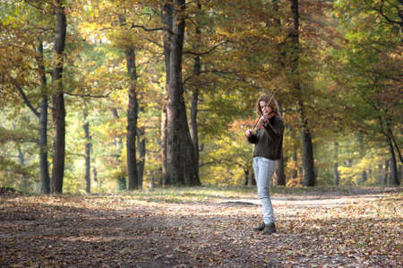 Pretty girl playing the violin の写真素材