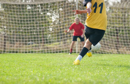 kicking and  Defending in soccerの写真素材