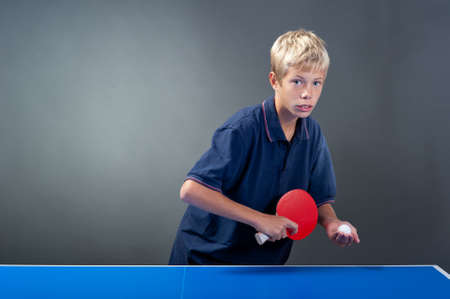 Young sportsman playing table tennisの写真素材