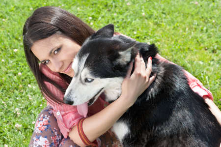  girl and her faithful siberian huskyの写真素材