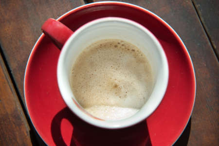 Cup of coffee on a wooden base.の写真素材