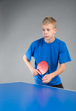 Young sportsman playing table tennisの写真素材