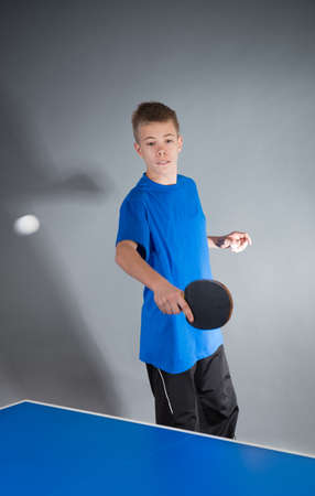 Young sportsman playing table tennisの写真素材