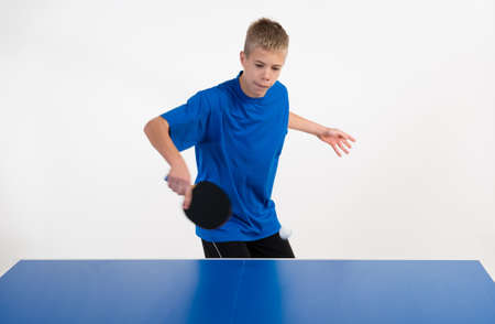 Young sportsman playing table tennisの写真素材