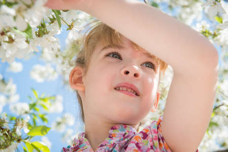 portrait of a little girl with flowersの写真素材