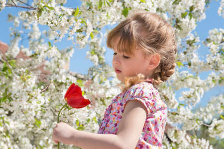 portrait of a little girl with flowersの写真素材