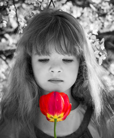 portrait of a little girl with flowersの写真素材