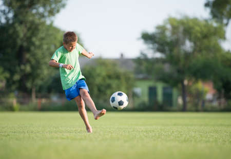 Little Boy Shooting at Goalの写真素材