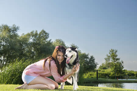 girl and her faithful huskyの写真素材
