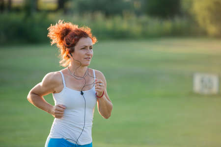 pretty girl jogging in nature