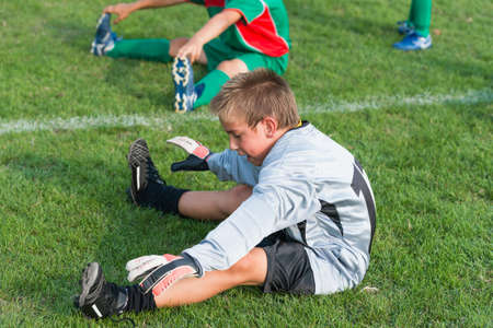 goalkeeper do stretching before football matchの写真素材