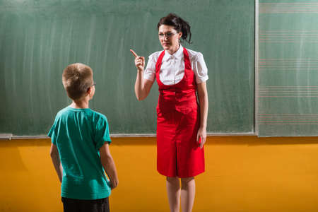 female techer looking  to her student with severe attitudeの写真素材