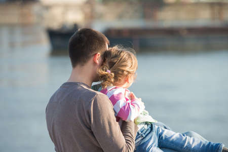 Daddy and young daughter have funの写真素材