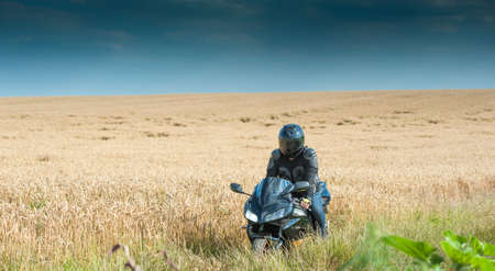 Biker man riding on a bikeの写真素材