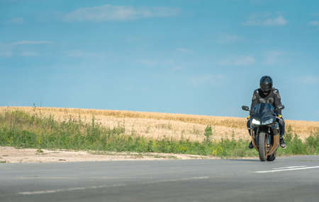 Biker man riding on a bikeの写真素材