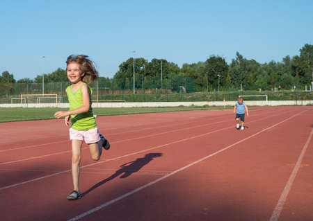 children running on the trackの写真素材