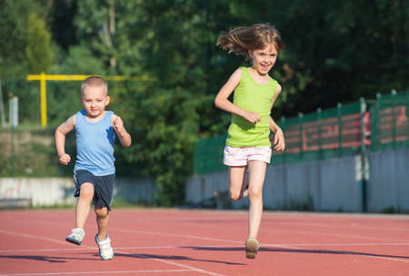 children running on the trackの写真素材