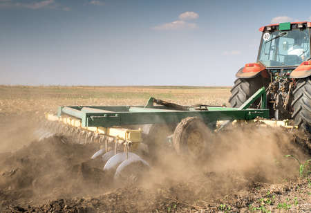 Tractor preparing land for sowing