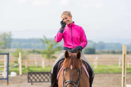 Young girl riding a horse