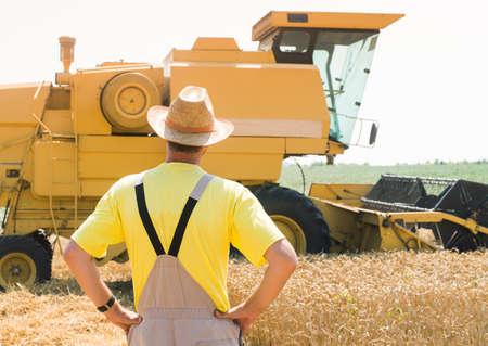 farmer next to the combine
