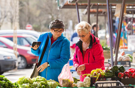 senior ladies at farmers marketの写真素材