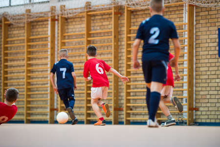 Boys kicking ball at goalの写真素材