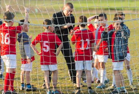 Discussion of the kid soccer team before the matchの写真素材
