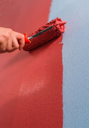 Close up paint roller on the wall.の写真素材